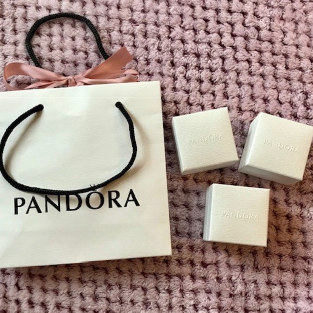 Three authentic Pandora charm boxes and bag